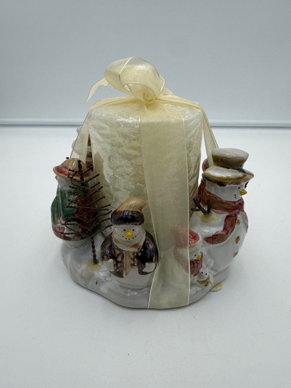 Kohl's branded ceramic pillar candle Circle of Friends" snowman design.